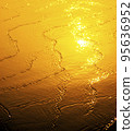 Wave on the beach at sunset 95636952