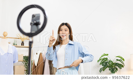 Beautiful woman with a social media influence is greeting the audience for recording vlog video live streaming, Online fashion clothing business, Using psychology to generate interest in customers. 95637622