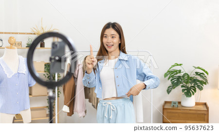 Beautiful woman with a social media influence is greeting the audience for recording vlog video live streaming, Online fashion clothing business, Using psychology to generate interest in customers. 95637623