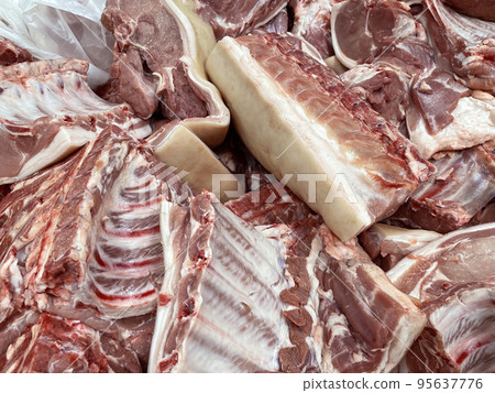 Pork meat. Fresh animal meat for sale. Large pieces of meat in the store. Texture 95637776