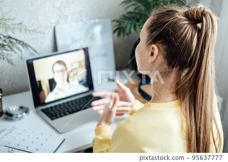 Young woman business woman student teacher tutor having online virtual video call. Freelancer having video conference calling on laptop computer talk by webcam learn teach in online chat Young woman business woman student teacher tutor having online virtual video call. Freelancer having video conference calling on laptop computer talk by webcam learn teach in online chat 95637777