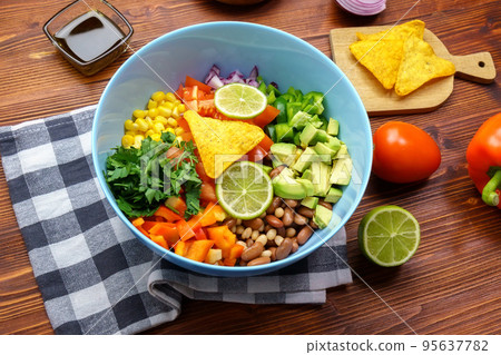 Cowboy caviar is traditional mexican vegetable salad. Corn, beans, tomatoes, peppers, onions lime avocado Cowboy caviar is traditional mexican vegetable salad. Corn, beans, tomatoes, peppers, onions lime avocado 95637782