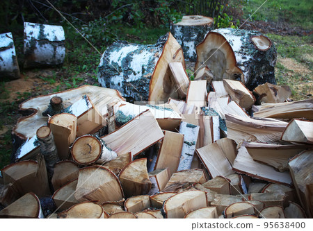 Chopped firewood on a stack 95638400