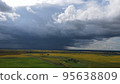 Aerial top view photo from flying drone of a land with down fields in countryside. 95638809