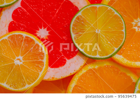 Citrus fruits slices - orange, grapefruit, lemon and lime - close up, top view Citrus fruits slices - orange, grapefruit, lemon and lime - close up, top view 95639475