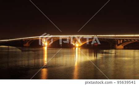 City bridge over river with lights reflection in water at night City bridge over river with lights reflection in water at night 95639541