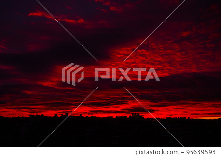 Colorful red sunrise over city and dramatic sky with clouds Colorful red sunrise over city and dramatic sky with clouds 95639593