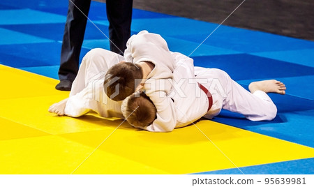Two boys fighter compete in Judo Two boys fighter compete in Judo 95639981