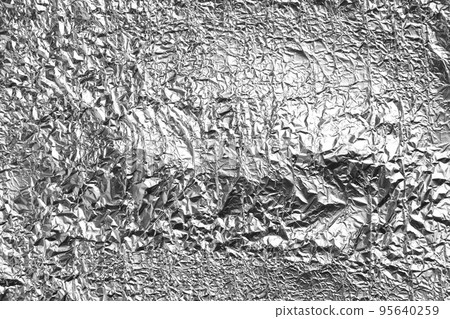 Crumpled silver foil as background, closeup view 95640259