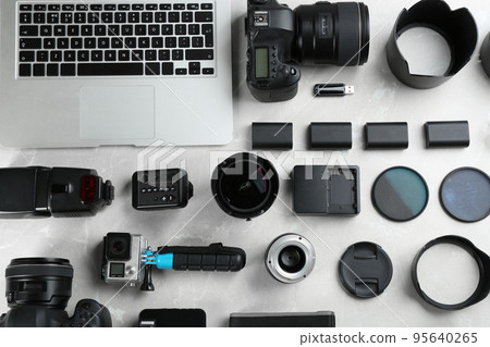 Flat lay composition with equipment for professional photographer on grey marble table 95640265