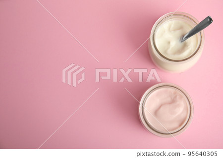 Tasty organic yogurt on pink background, flat lay. Space for text Tasty organic yogurt on pink background, flat lay. Space for text 95640305