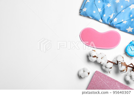 Composition with sleeping mask on white background, top view. Bedtime accessories Composition with sleeping mask on white background, top view. Bedtime accessories 95640307