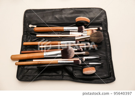 Organizer full of professional tools on makeup artists workplace 95640397