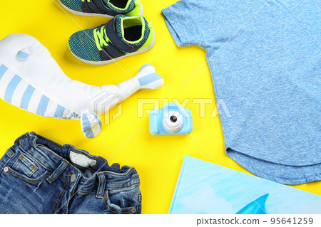 Flat lay composition with toy camera for little photographer on yellow background Flat lay composition with toy camera for little photographer on yellow background 95641259