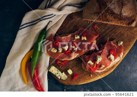 rye bread with slices of jamon and cheese rye bread with slices of jamon and cheese 95641621