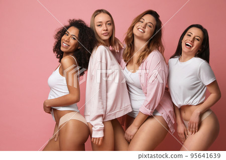 Group of women with different body types in underwear on pink background Group of women with different body types in underwear on pink background 95641639
