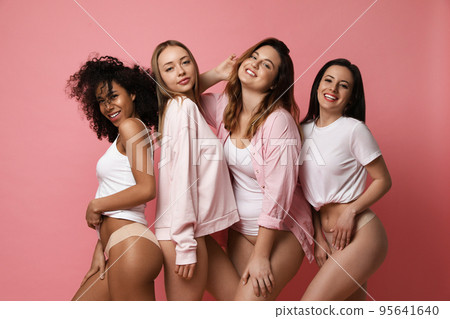 Group of women with different body types in underwear on pink background Group of women with different body types in underwear on pink background 95641640