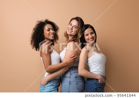 Group of women with different body types on beige background Group of women with different body types on beige background 95641844