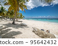 Coconut Palm trees on white sandy beach in Punta Cana, Dominican Republic. High quality photo 95642432