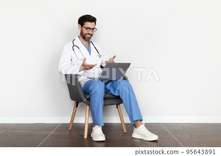 Telemedicine Concept. Smiling Male Doctor Using Laptop For Teleconference With Patient 95643891