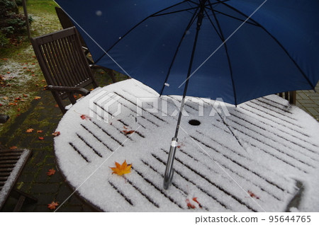 Snow and umbrella 95644765