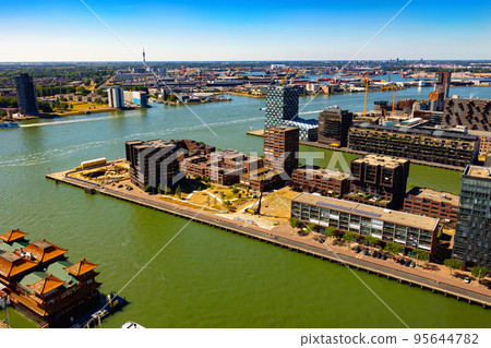 Drone view of Rotterdam Sea Port at mouth of rivers Rhine and Meuse on summer day Drone view of Rotterdam Sea Port at mouth of rivers Rhine and Meuse on summer day 95644782