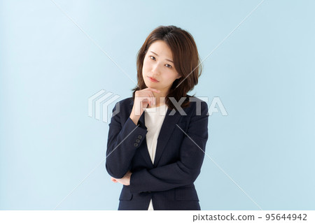 A woman in a suit blue back 95644942