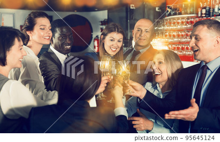 International group of businesspeople toasting with champagne, h International group of businesspeople toasting with champagne, h 95645124