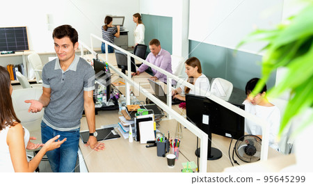 Portrait of successful adult businessman during daily work in modern co-working space Portrait of successful adult businessman during daily work in modern co-working space 95645299