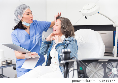Woman satisfied with results of cosmetic procedures 95645477