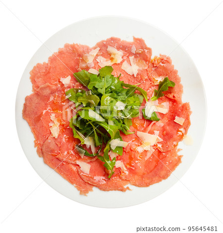 Appetizing fresh meat carpaccio from thinly sliced raw veal with cheese and arugula. Dish of Mediterranean cuisine 95645481