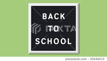 Image of back to school on board over green background 95646014