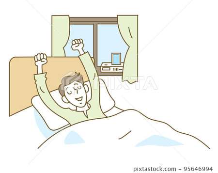 Young man waking up in bed at home 95646994