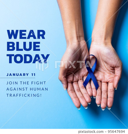 Wear blue today, join the fight against human trafficking text and caucasian hands with blue ribbon 95647694