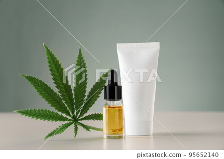 Distillation of marijuana leaf into CBD oil for dermatological purpose concept. Distillation of marijuana leaf into CBD oil for dermatological purpose concept. 95652140