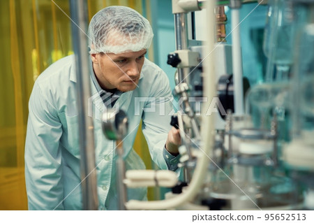 Apothecary extract using cannabis extraction machine in laboratory. Apothecary extract using cannabis extraction machine in laboratory. 95652513