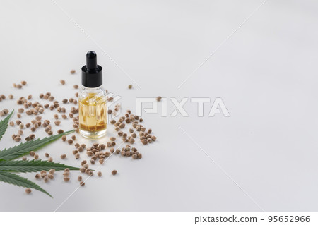 Sets of legalized marijuana features with CBD oil in bottle with dropper lid. 95652966