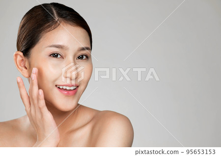 Closeup ardent young woman posing beauty gesture with clean fresh skin. Closeup ardent young woman posing beauty gesture with clean fresh skin. 95653153