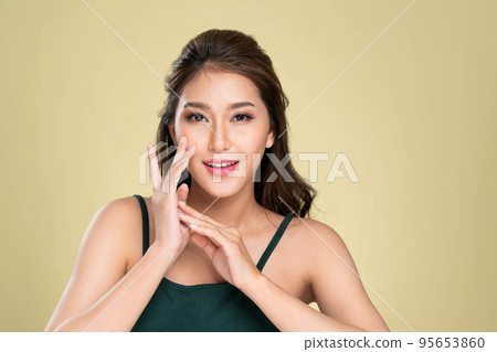 Portrait of ardent young girl posing beauty gesture with clean fresh skin. Portrait of ardent young girl posing beauty gesture with clean fresh skin. 95653860