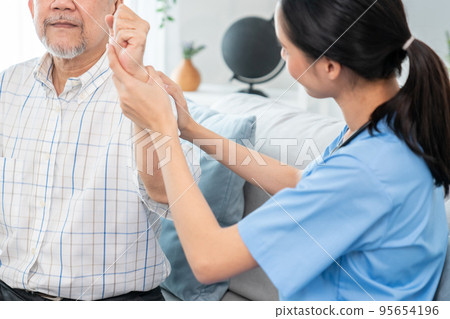 Caring young female doctor working with senior patient contented senior patient. Caring young female doctor working with senior patient contented senior patient. 95654196