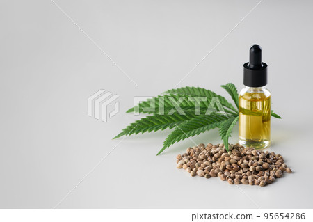 Legalized marijuana concept features with CBD oil for copyspace and advertising. Legalized marijuana concept features with CBD oil for copyspace and advertising. 95654286