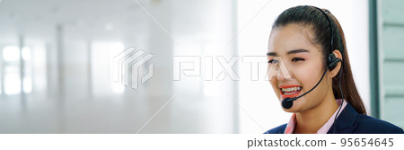 Business people wearing headset working in office in widen view 95654645