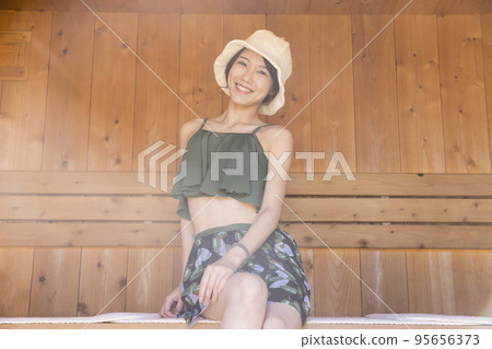 Sauna girls entering the sauna Sauna girls entering the sauna 95656373
