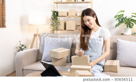 Online selling business, Small business owners are checking inventory in order to prepare them for proper delivery to customers, Online shopping SME entrepreneur, Delivery of goods to consumers. 95656511
