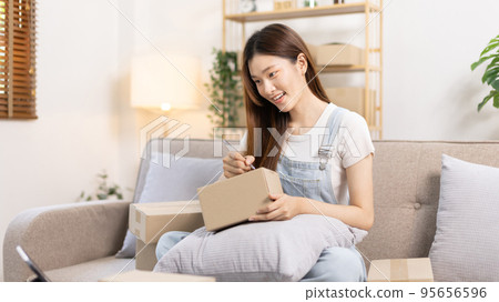 Online selling business, Small business owners are checking inventory in order to prepare them for proper delivery to customers, Online shopping SME entrepreneur, Delivery of goods to consumers. 95656596