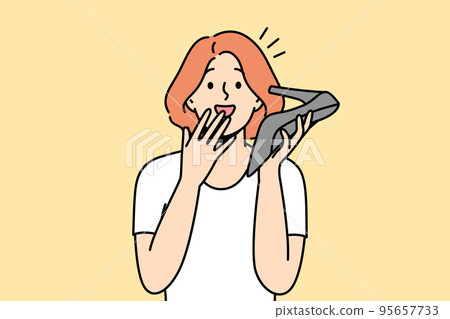 Stunned woman talk on shoe phone  95657733