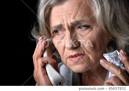 Elderly woman holding her hand to her throat. Disease Elderly woman holding her hand to her throat. Disease 95657852