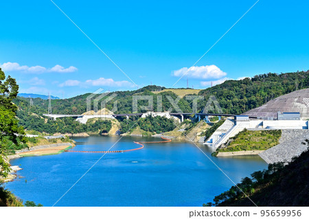 Aigawa Dam with blue sky background Aigawa Dam with blue sky background 95659956