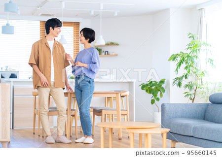 Married couple, family, lifestyle, living room Married couple, family, lifestyle, living room 95660145