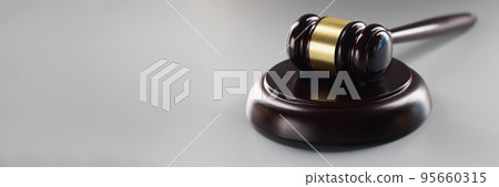 Brown judge wooden hammer on soundboard, attorney instrument for legal service 95660315